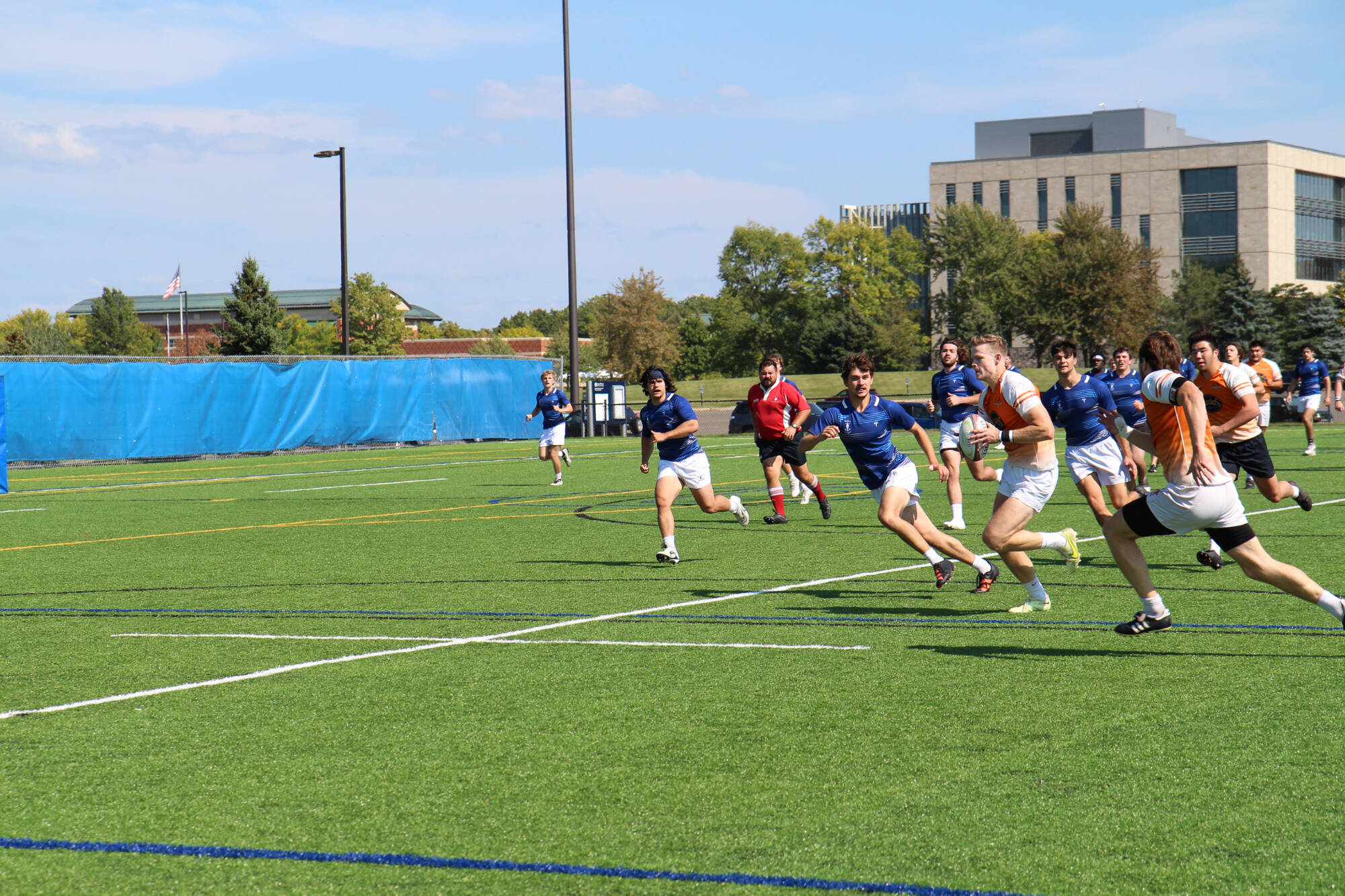 men's club rugby competition players moving with ball